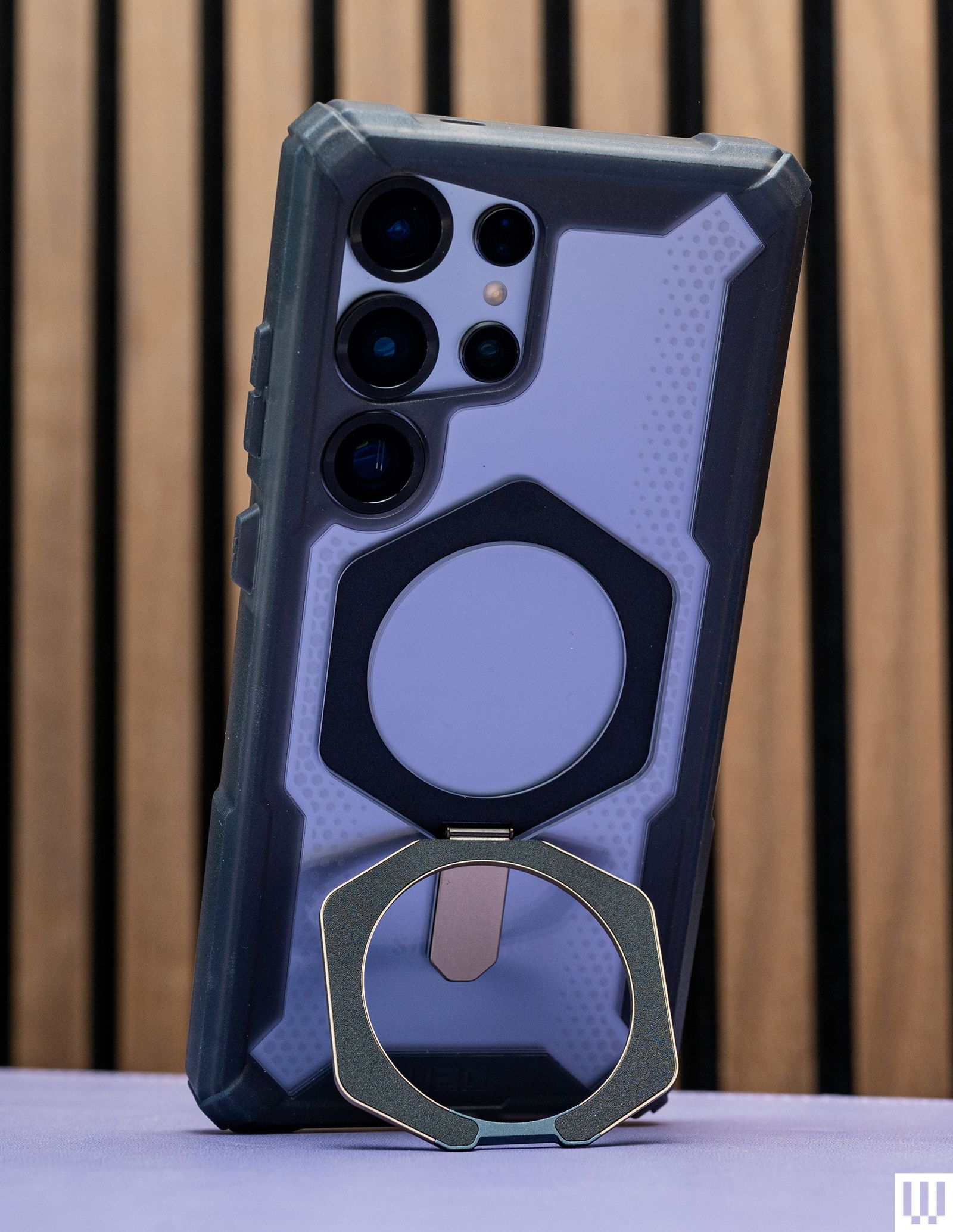 UAG Plasma XTE Magnetic Case an angular black and purple phone case with metallic ring to prop it up at an angle